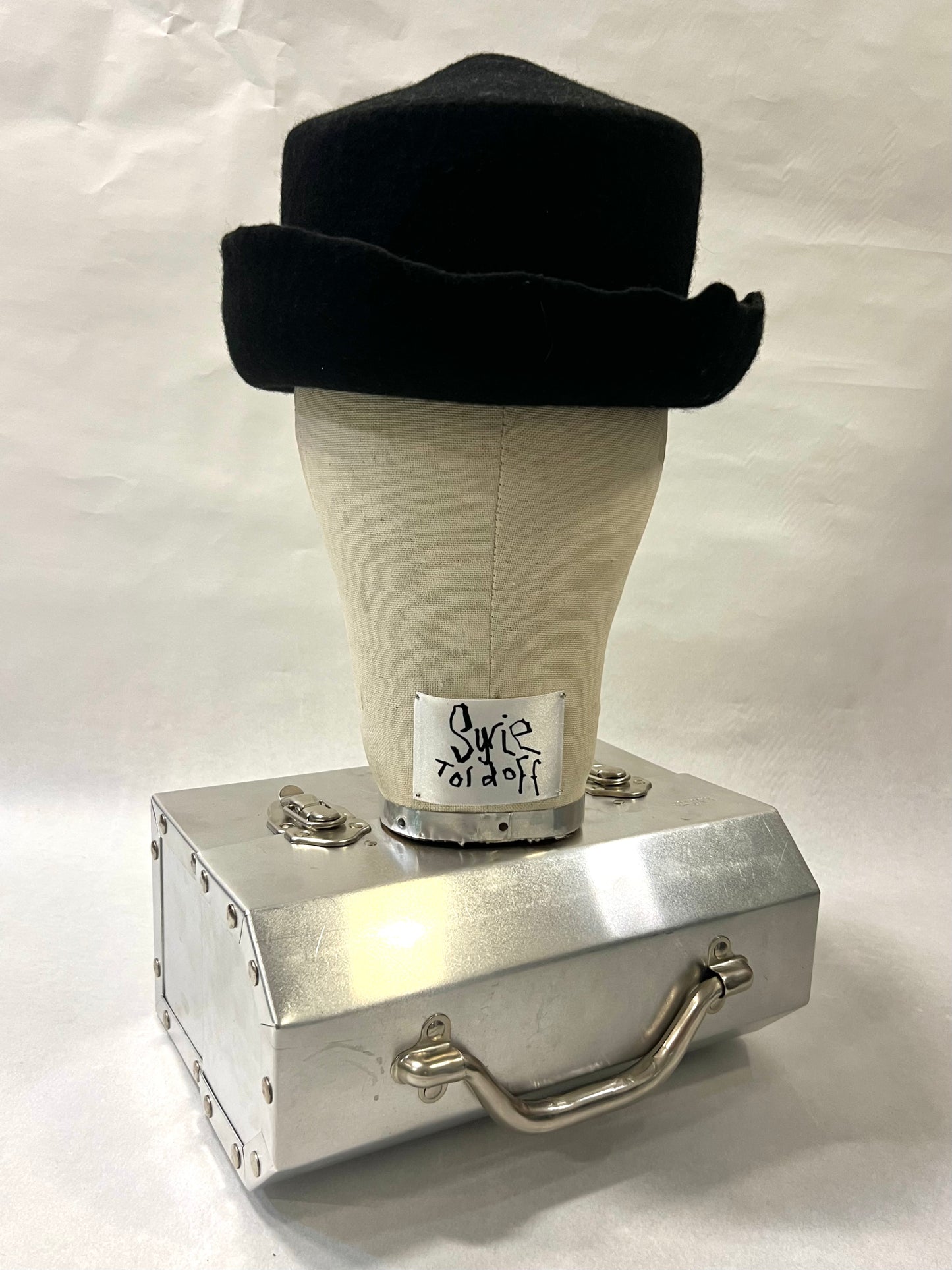 Brimmed pointed pork pie hat