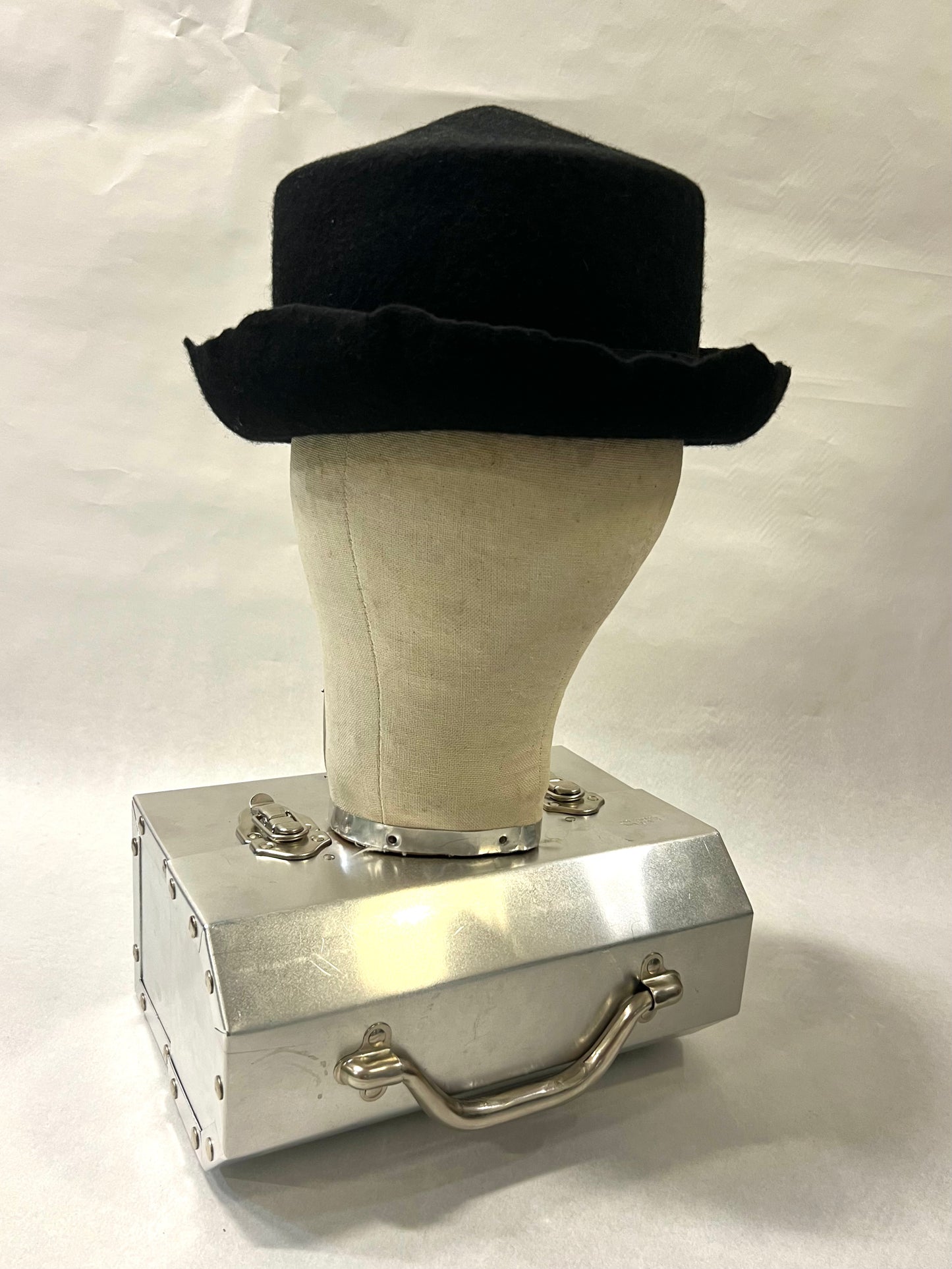 Brimmed pointed pork pie hat