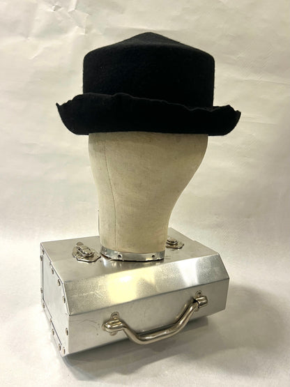Brimmed pointed pork pie hat