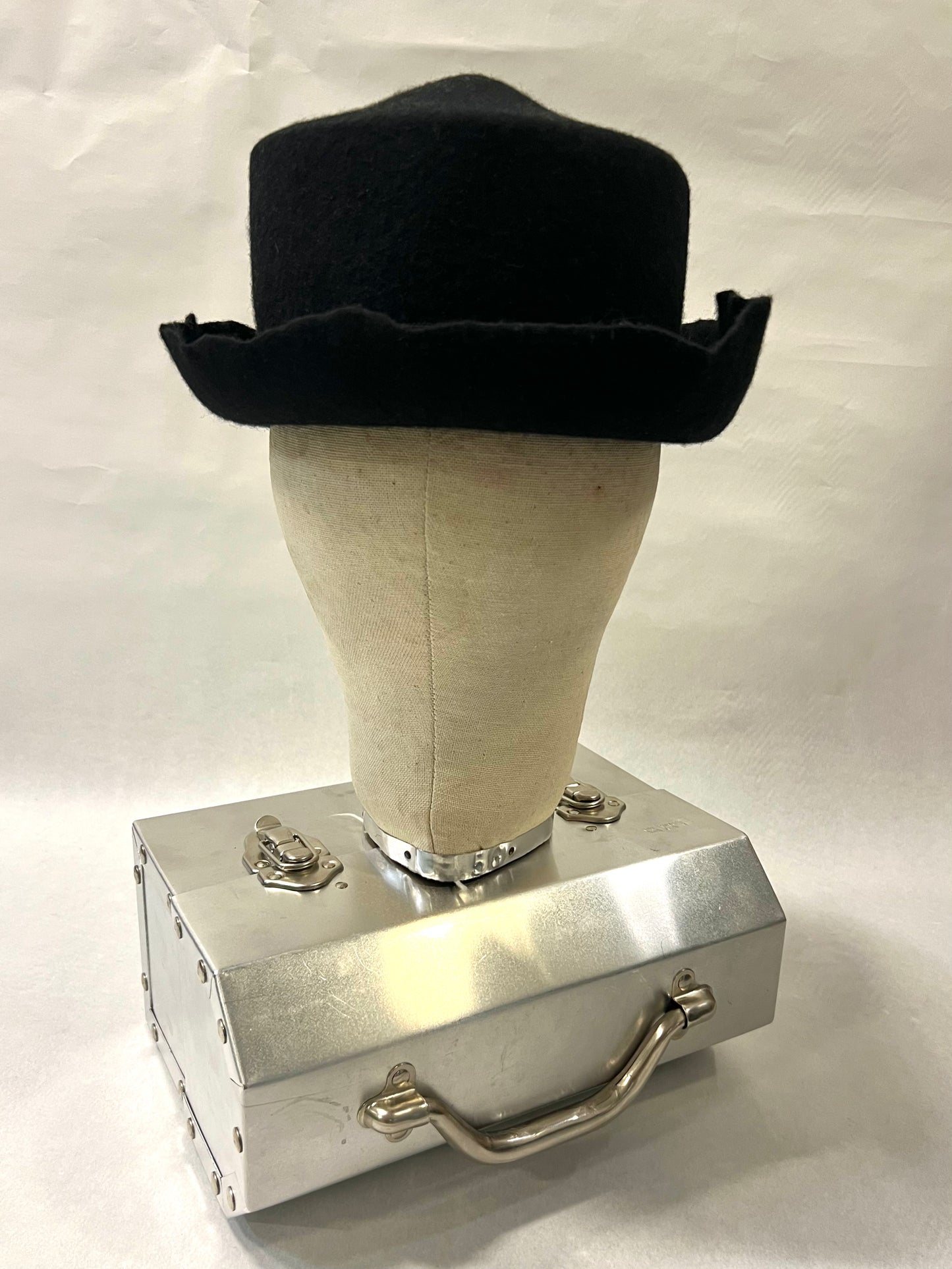 Brimmed pointed pork pie hat