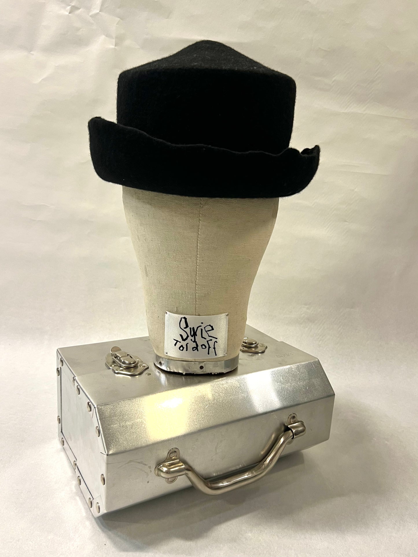 Brimmed pointed pork pie hat